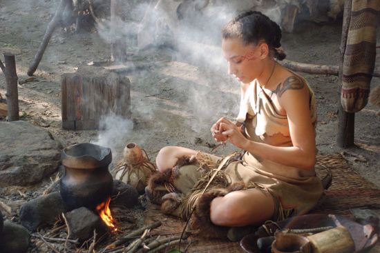 Native woman cooking at Wampanoag homesite